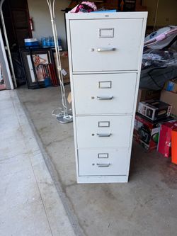 2 metal filing cabinets