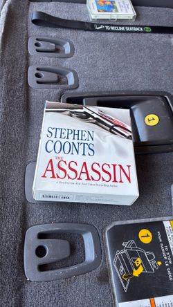 copy of the thriller novel The Assassin by Stephen Coonts