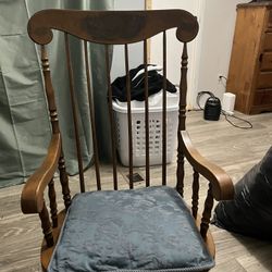 Old Wooden Rocking Chair With a design 