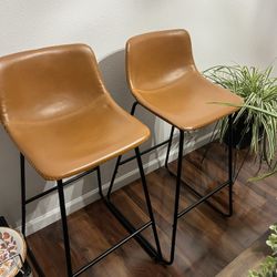 2 faux leather bar stools