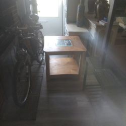 Brown Table With Glass In The Middle 