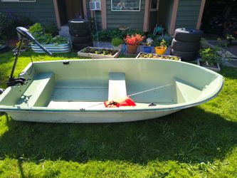Fiberglass boat, life jacket and rod. $250