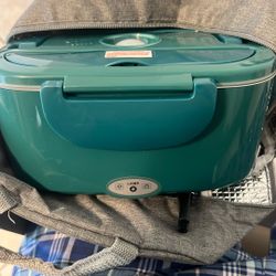 Portable electric food warmer in teal green