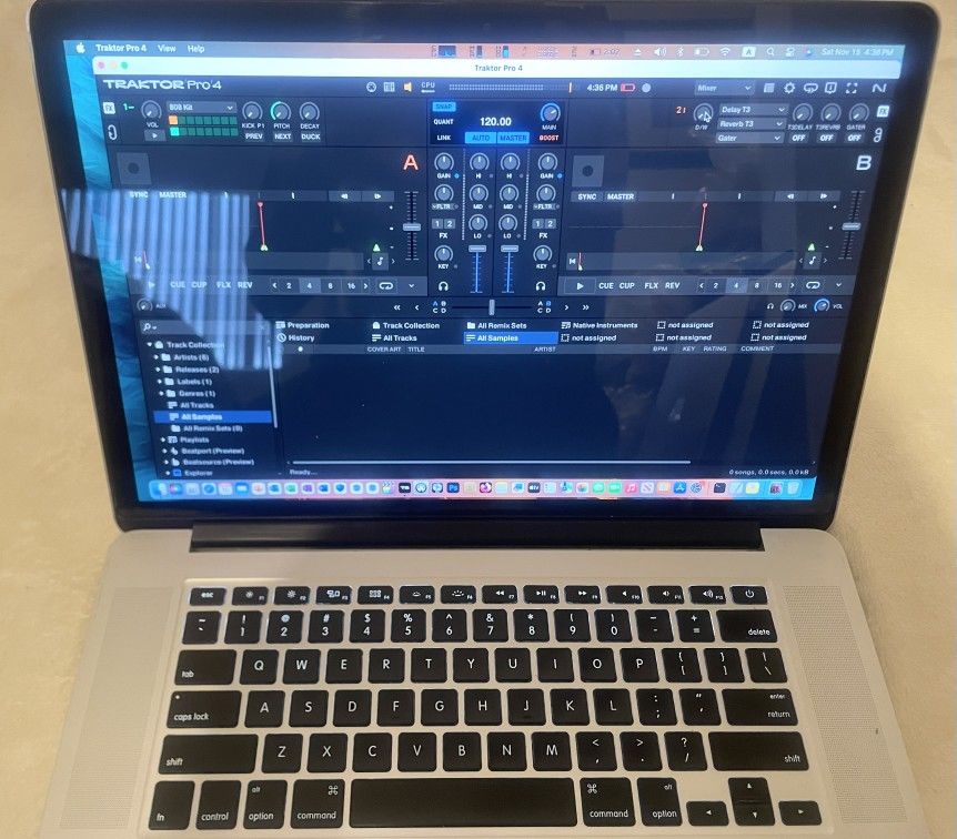 Macbook Pro With Music, Photo and Video Production Software 