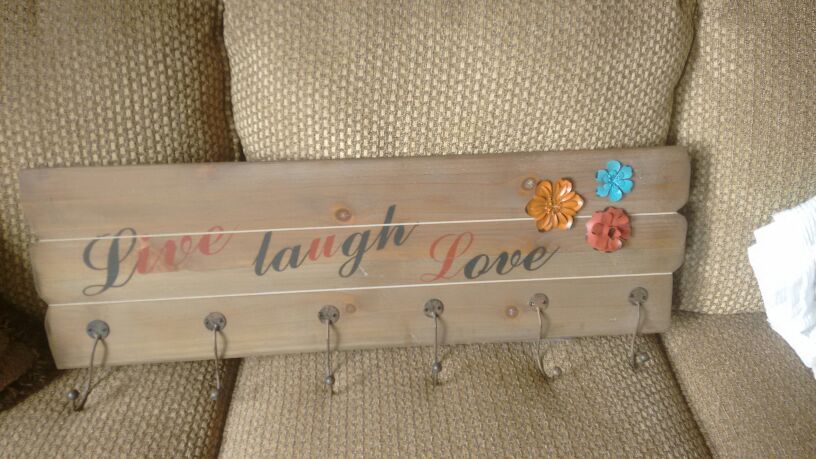 Live laugh love whit six hanging h.