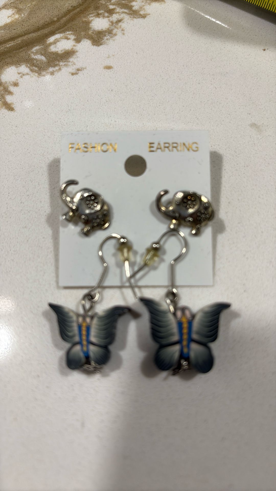 Elephant and butterfly earrings both for $5.