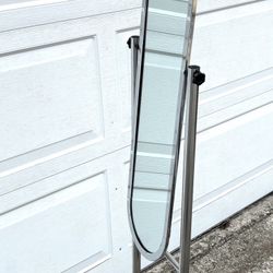 Beautiful, unique, light weight and slim mirror on wheels. Great for bedroom or bathroom. 66x13.5x15