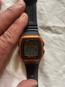 used Casio  watch casual orange color.