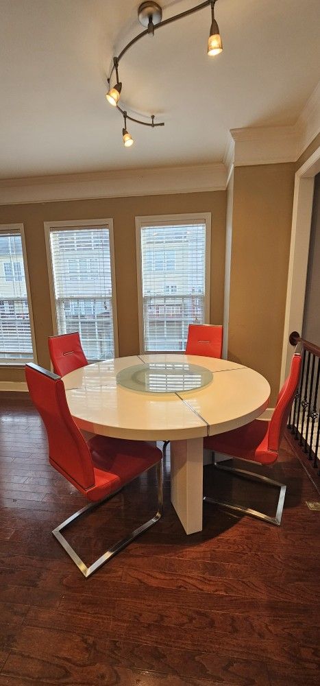 White Table With Red Leather Chairs