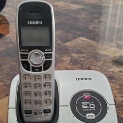 Uniden DECT1560 cordless phone with power cord and phone cord