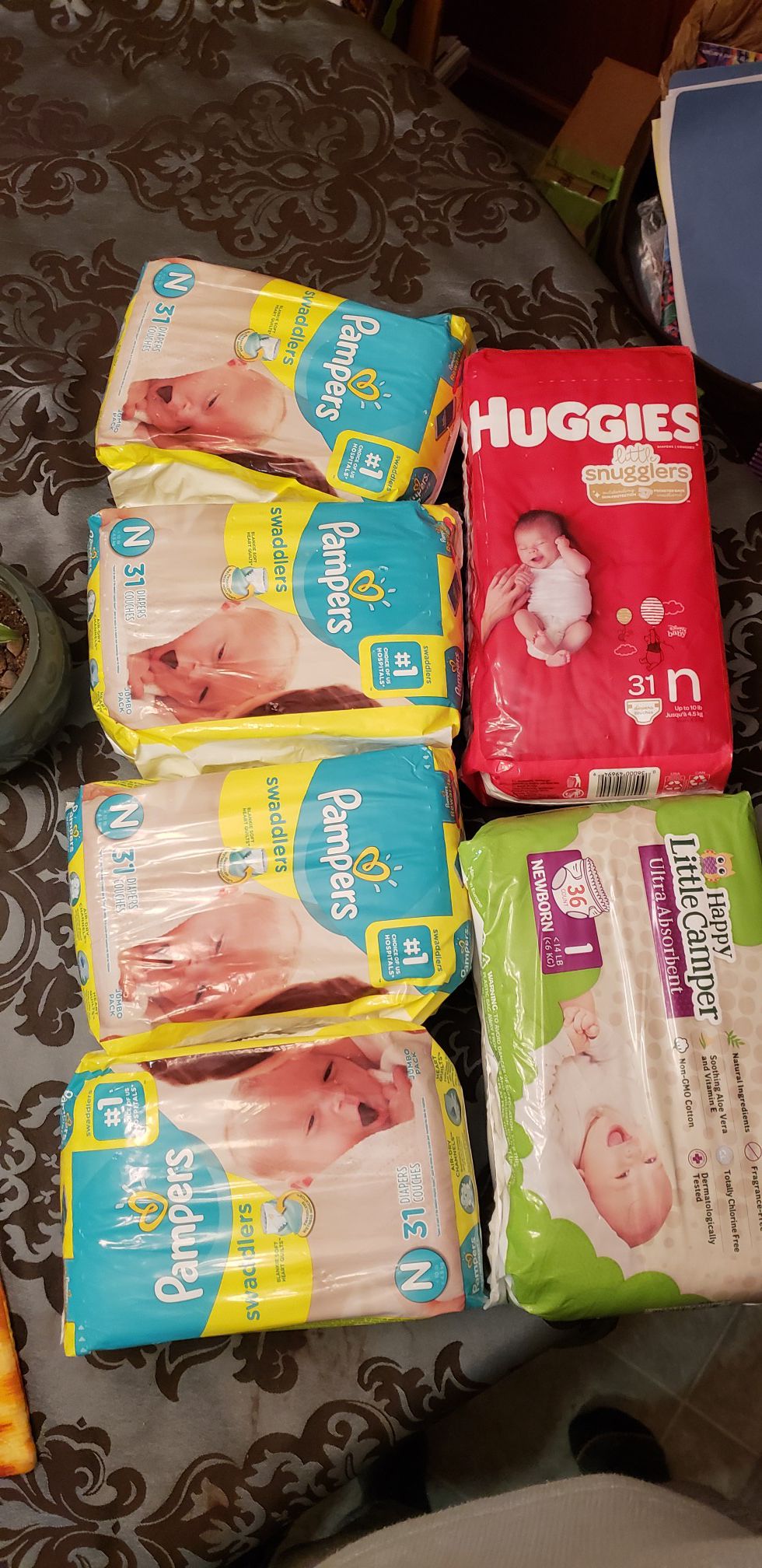 Unopened Huggies and Pampers diapers