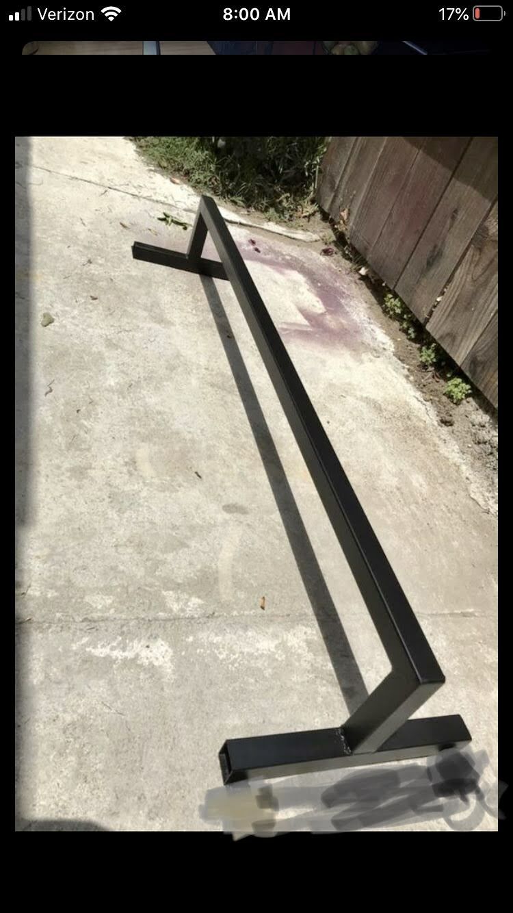 Fully welded skate rail with anchor brackets
