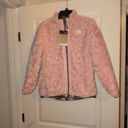 This is a North Face reversible coat, size 14/16