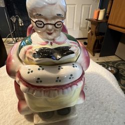 ANTIQUE GRANNY  SITTING ON WHERL CHAIR POTTERY STORAGE