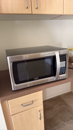 Oster Stainless Steel Countertop Microwave – Works Great
