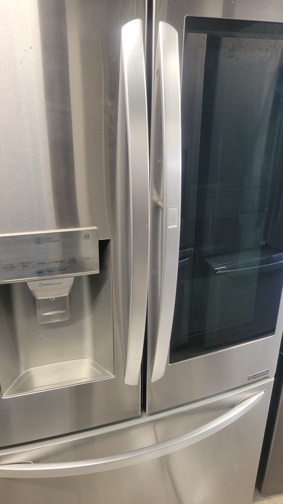 LG REFRIGERATOR WITH INSTAVIEW DOOR FEATURE AND NEW COMPRESSOR INSTALLED WORKS GREAT CAN DELIVER 