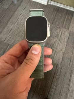 Apple Watch Ultra with Alpine Loop Band and Charger Cable