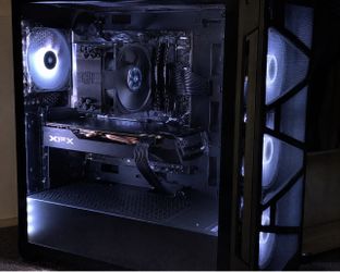 AMD Ryzen CPU with a Cooler Master cooler, an XFX graphics card, and a gaming-style case,