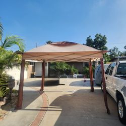 New 10 by 10 pop up tent/ canopy with mosquito netting