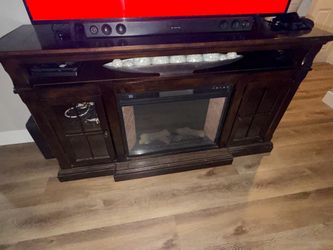 Tv stand with a fireplace