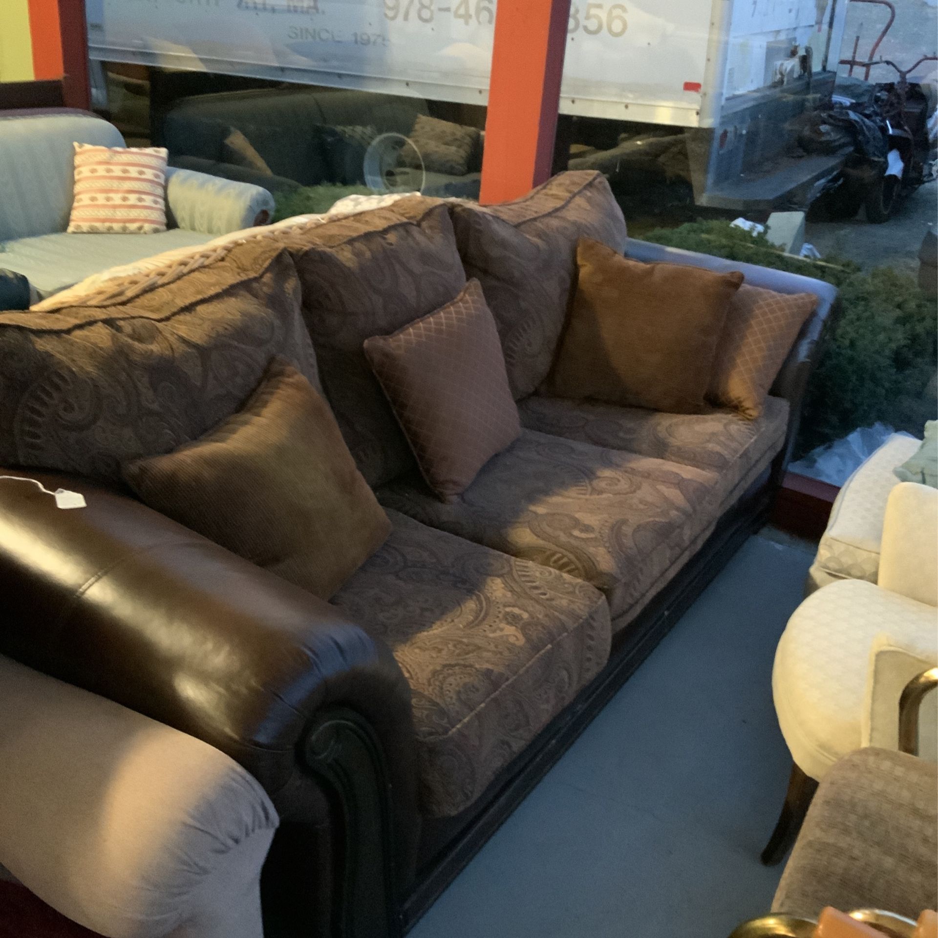 Brown Leather And Paisley Couch