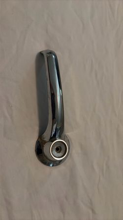 vintage chrome interior sliding door handle from a 1975–1983 Ford Econoline Van.
