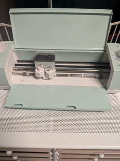Cricut vinyl cutter and craft supplies. $100