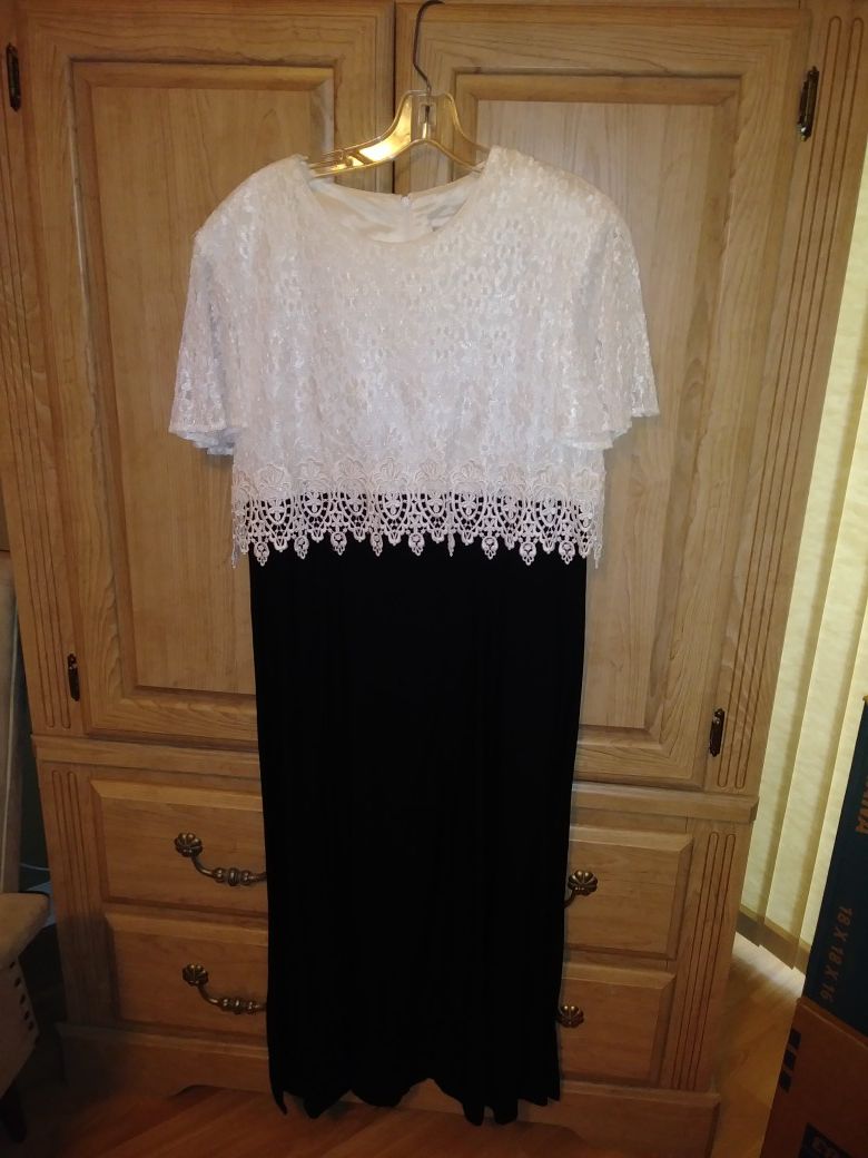 Elegant black evening dress with white lace topper.
