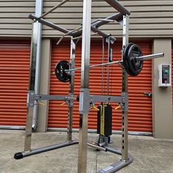 READ DESCRIPTION BELOW.  TuffStuff  Power Cage  w/  Weight Stack Pulley System & Weight Set  DELIVERY AVAIL. PRICE FIRM.