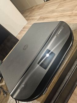 The HP ENVY 5052 is a wireless all-in-one thermal inkjet printer designed for home use.