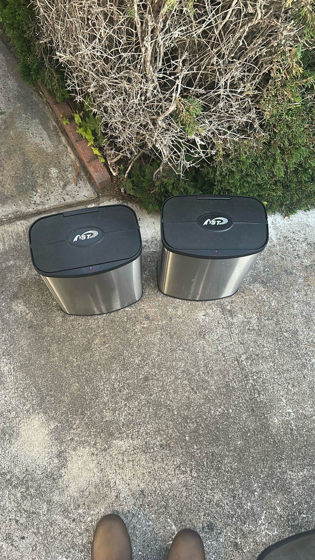 two motion sensor trash cans