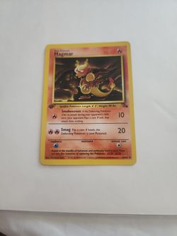 1999 first edition Magmar Pokémon card from the Fossil set. 