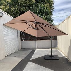Brand New $195 Hanging Patio 10x10 FT Offset Umbrella with Crank, Tilt, Cross Stand (Include 4pcs Base)