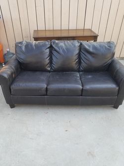 Brown leather sofa sleeper