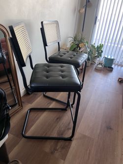 2 matching rattan back counter stools