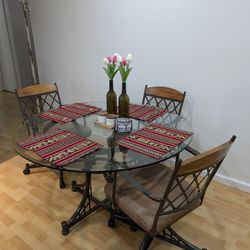 Glass top dining table with 4 wheeled chairs (48 in)