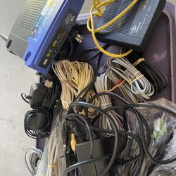 Linksys Modem. Ethernet Box And Tons Of Plugs. Cables. Transformers. 