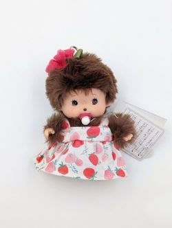 Monchhichi doll with a dress outfit. Looks like “Punch” the monkey