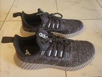 Adidas Kaptir 3.0 sneakers featuring a black knit upper with grey accents and a chunky cushioned midsole.