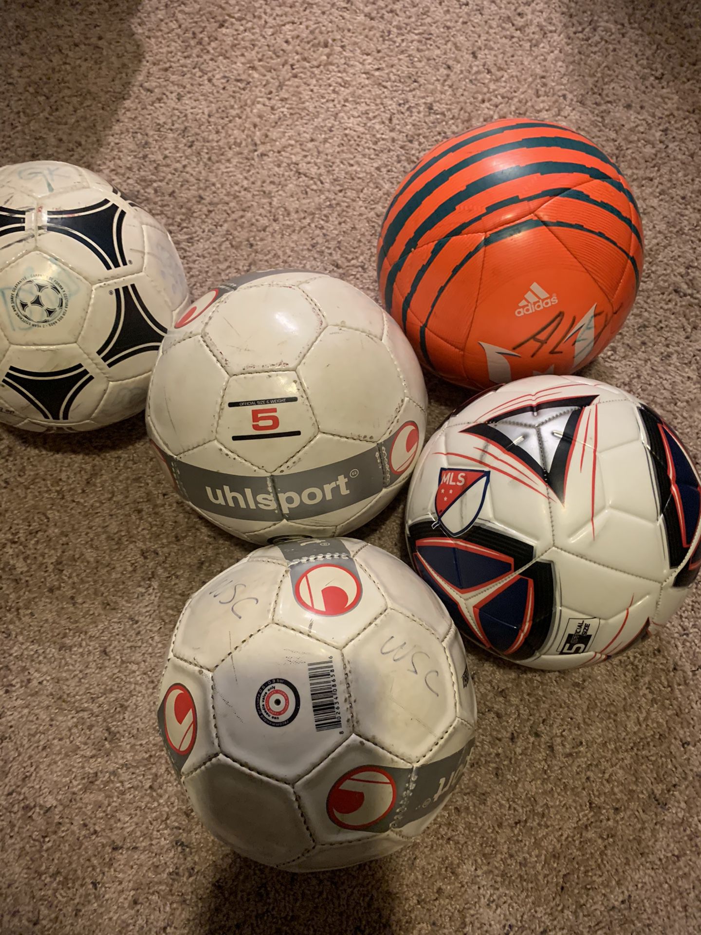 Variety of used soccer balls