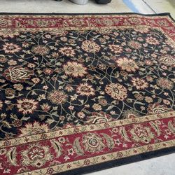 Elegant Traditional Floral Area Rug – Black & Burgundy (Excellent Condition) Beautiful traditional-style area rug with a rich black background and bur