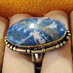 UNIQUELY RARE IN DESIGN AND CUT.  NATURALLY BEAUTIFUL, WITHIN THIS OVAL, HAND CUT SODALITE, STERLING, SIZE 8.5- 8.75