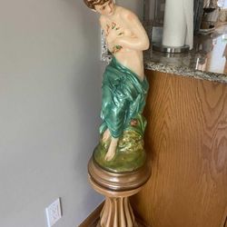 Beautiful woman statue with stand