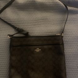 Brown and black coach crossbody bag