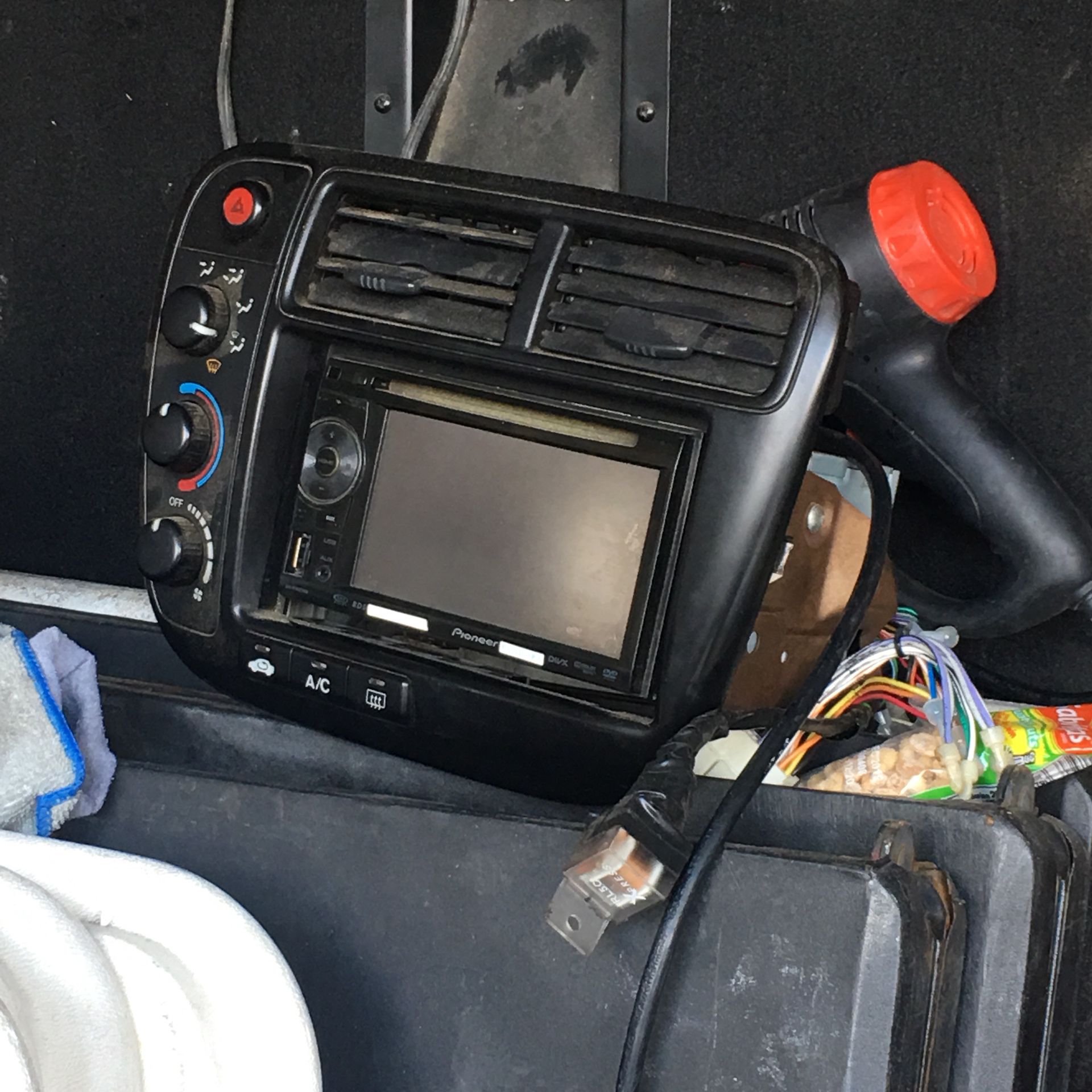 Em1 climate center console with pioneer radio