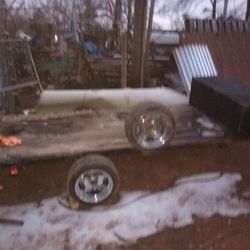 Flat Trailer New Tires And A Spare And A Toolbox On The Front