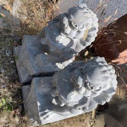 Sculptured stone lions 2’ tall.  