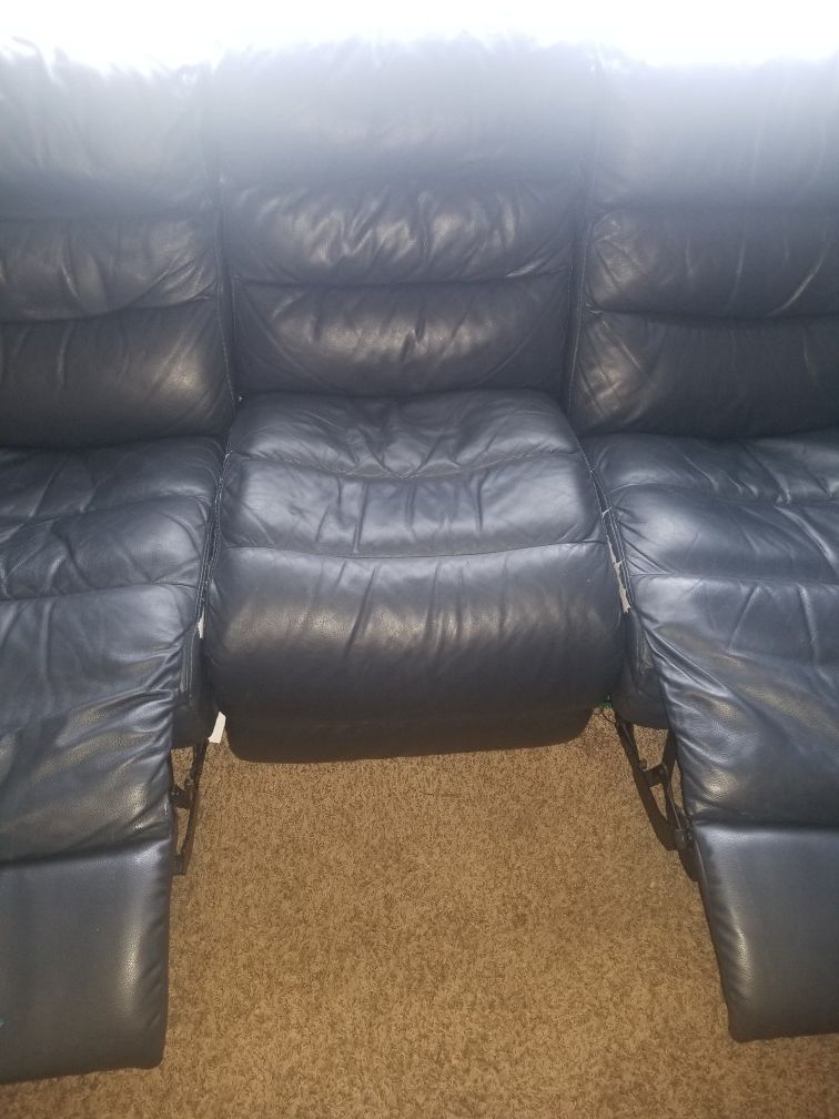 Dark blue leather recliner couch