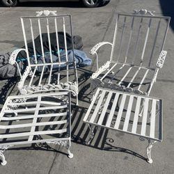 Antique cast-iron garden chairs, spring seat, backing with ottoman and table