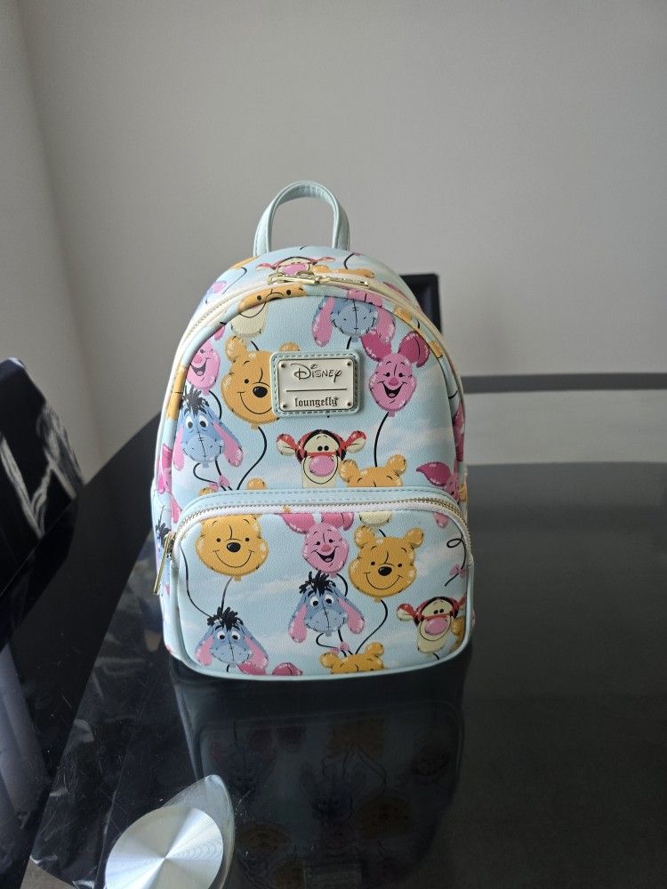 Disney's Loungefly Pooh, Tigger, Eeyore, and Piglet-shaped balloon pattern Mini Backpack